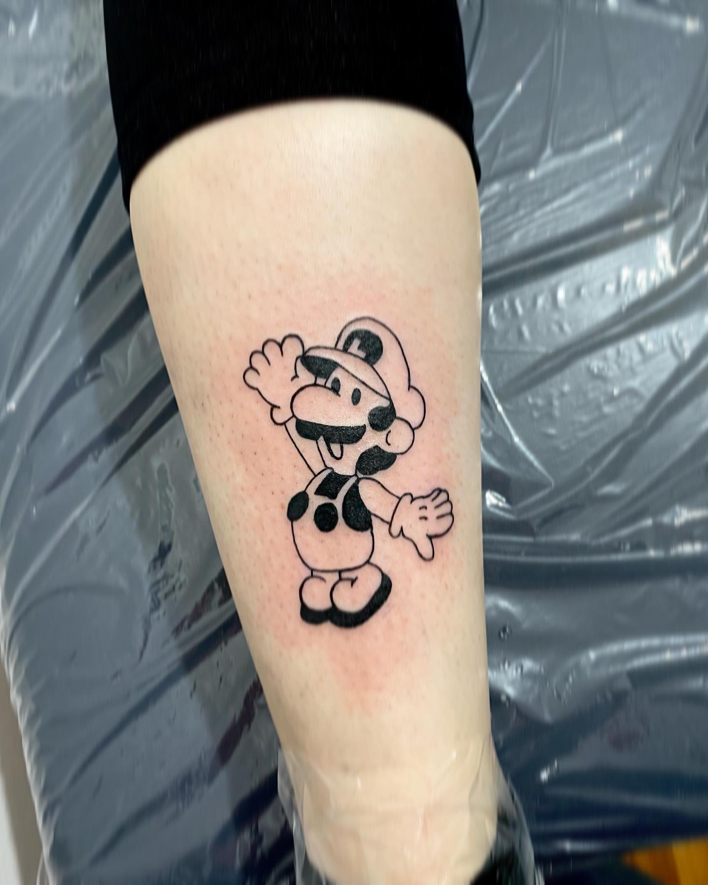 Tatuaje de ternero de Mario