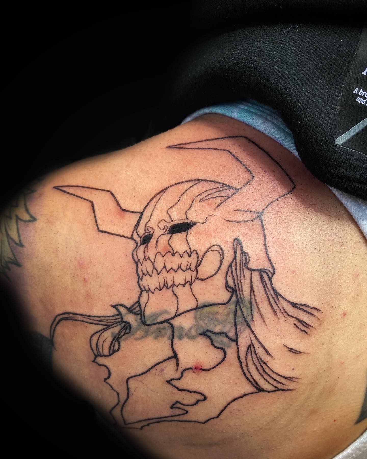 Tatuaje de Grimmjaw en el antebrazo