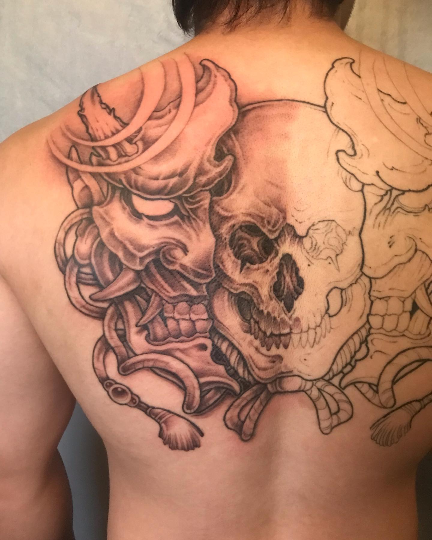 Tatuaje de Calavera Genial en la Espalda