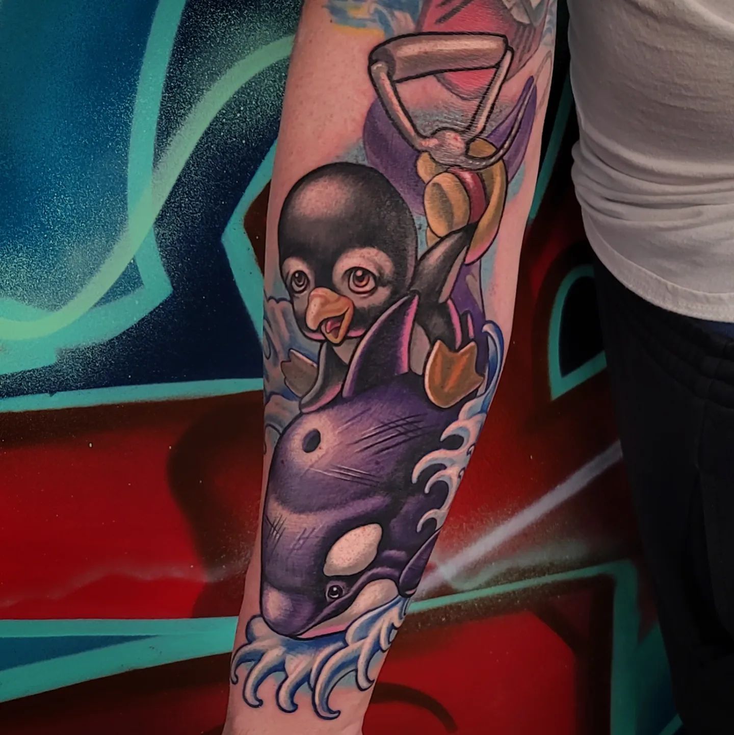 Tatuaje de orca y pingüino