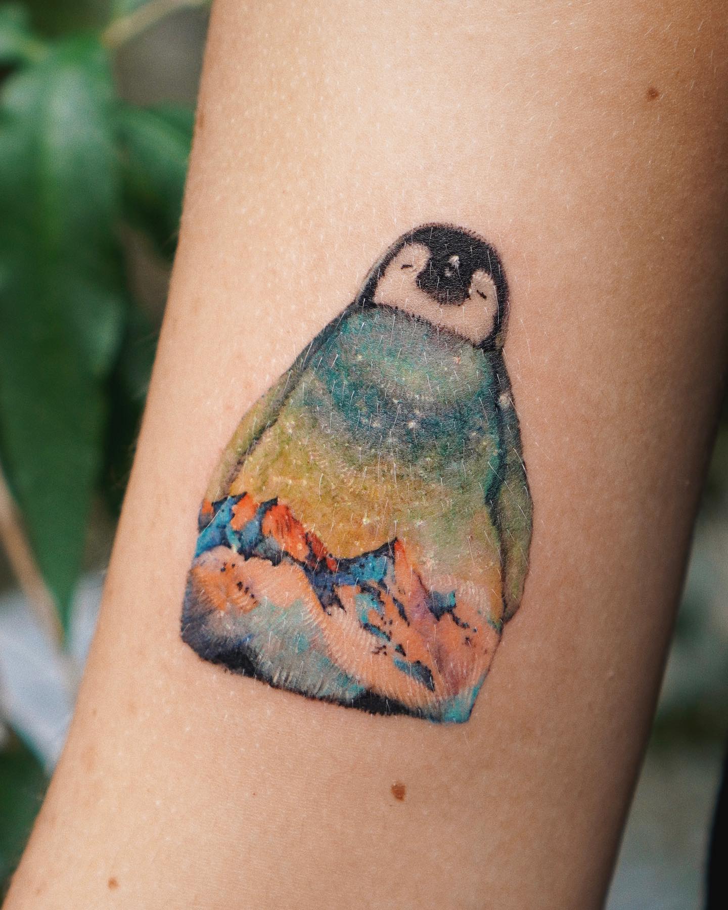 Tatuaje de pingüino superpuesto en la Antártida