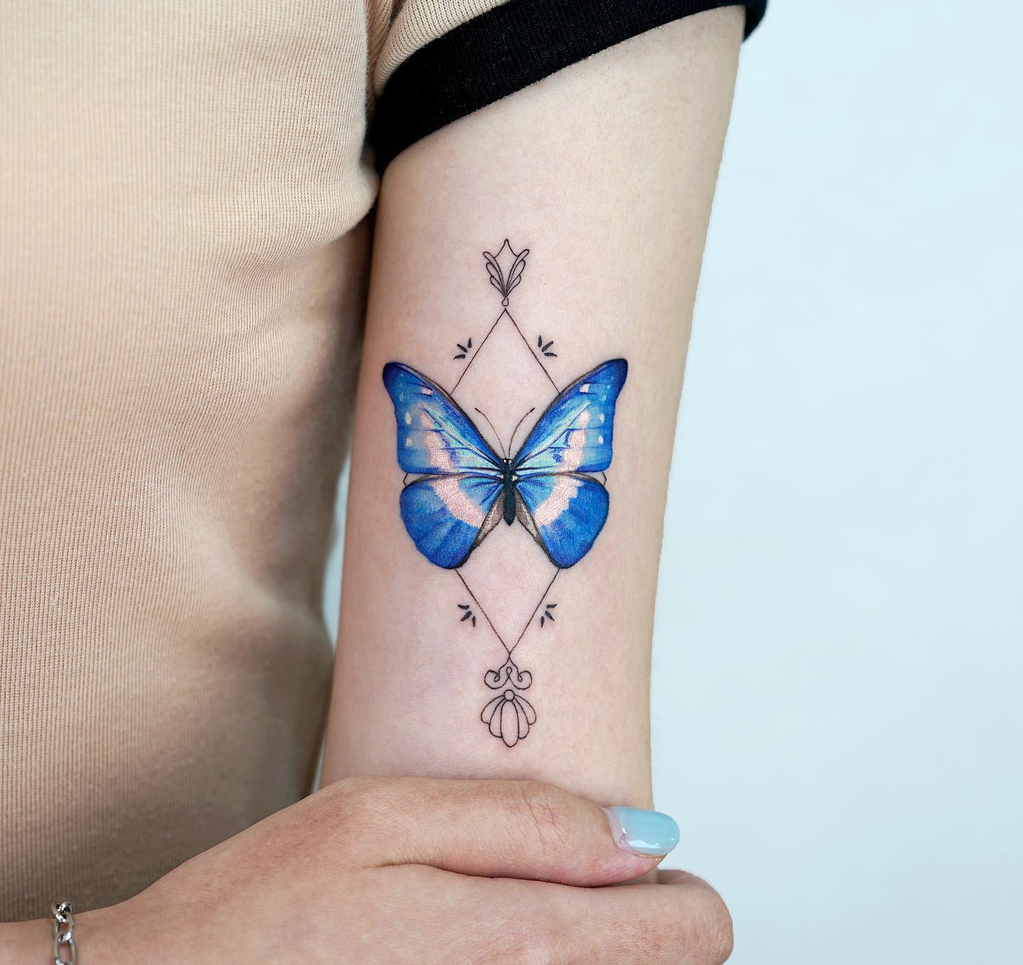 Tatuaje de Mariposa en el Brazo