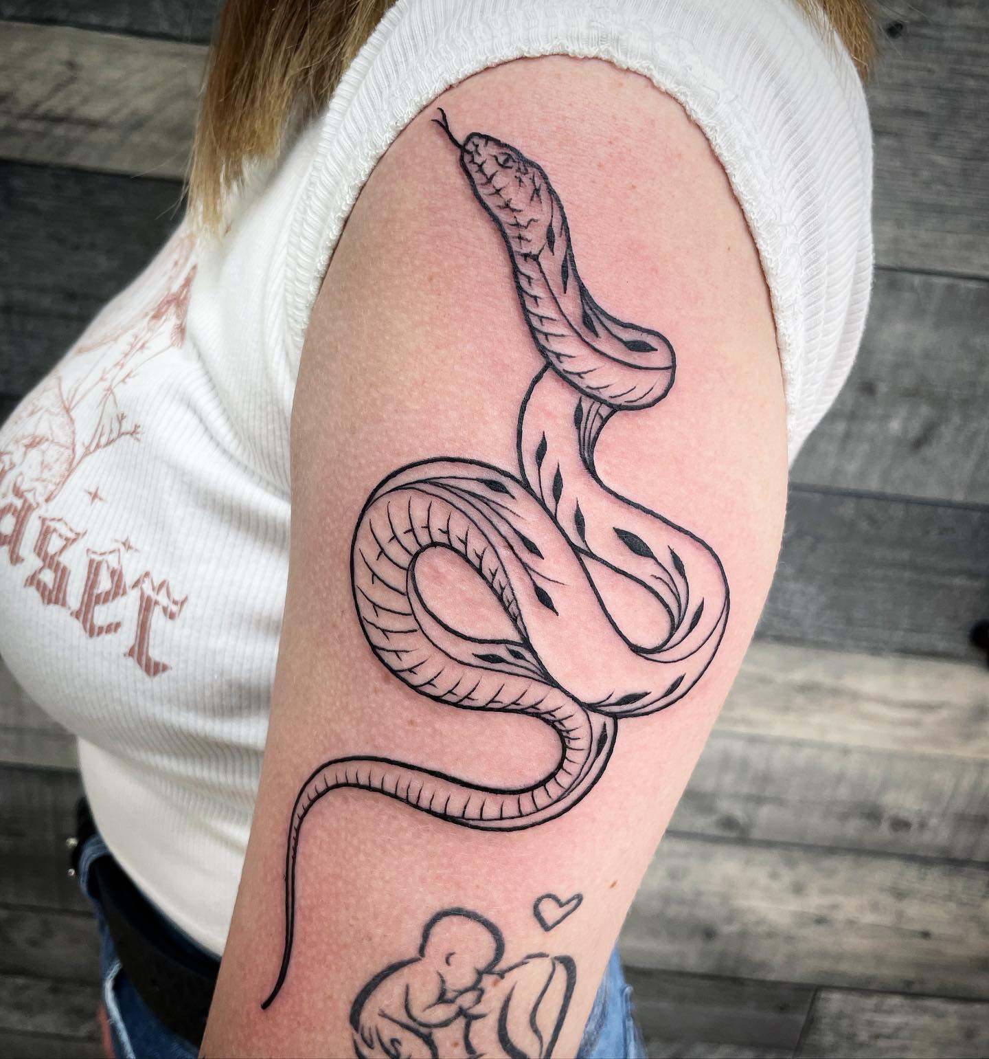 Tatuaje de Serpiente en el Brazo