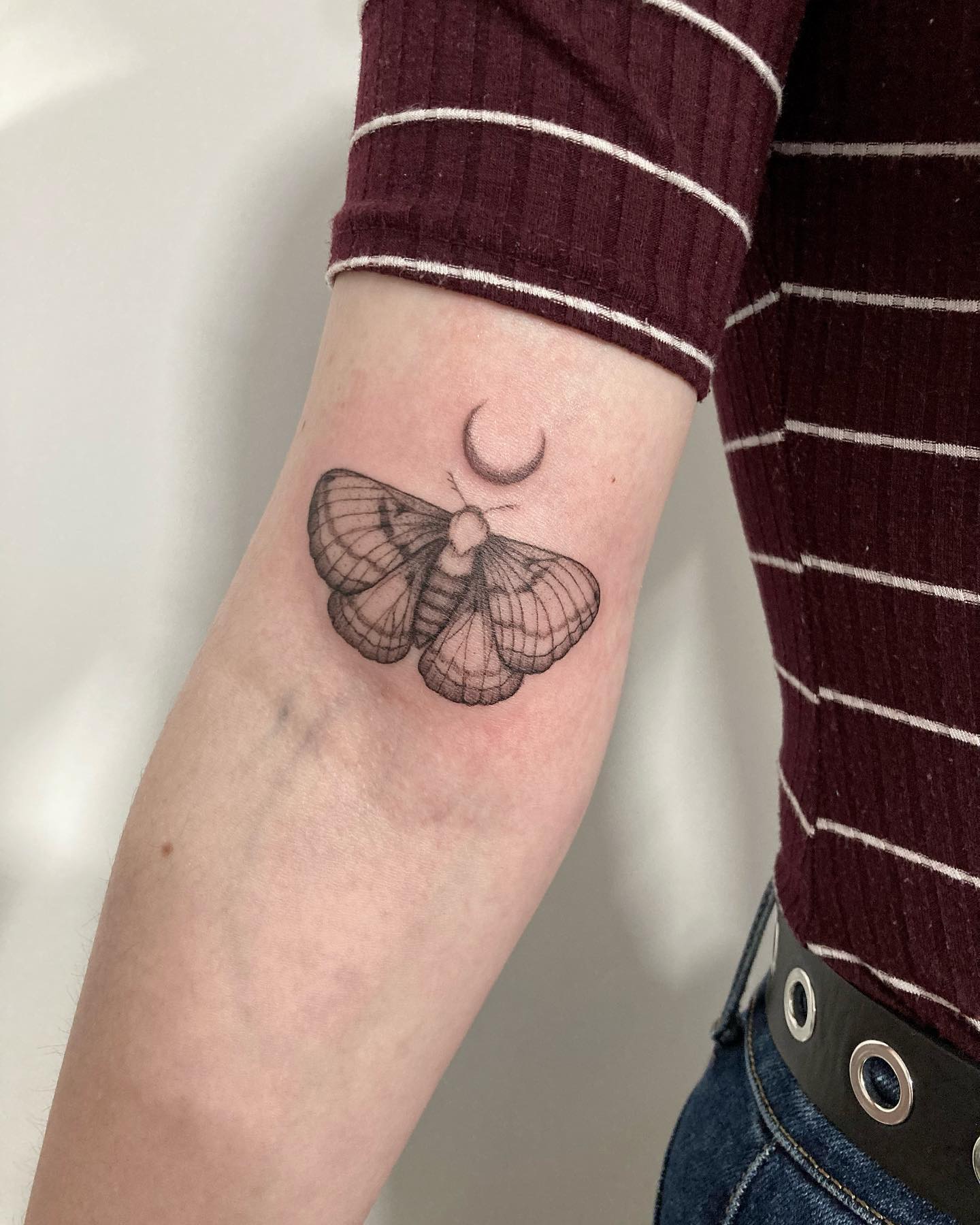 Mariposa con un tatuaje de Luna.