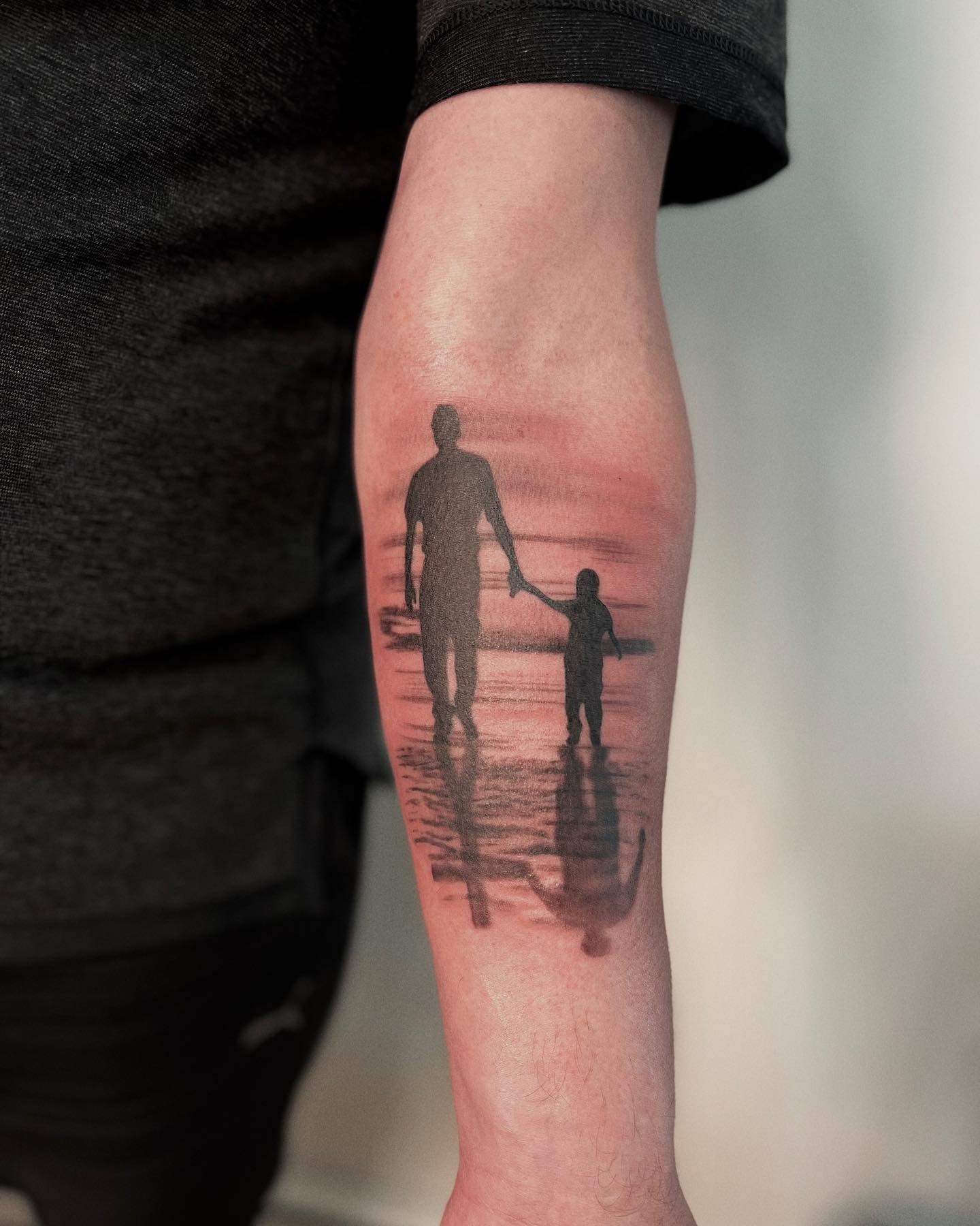 Tatuaje de Padre e Hijo que reconforta el corazón