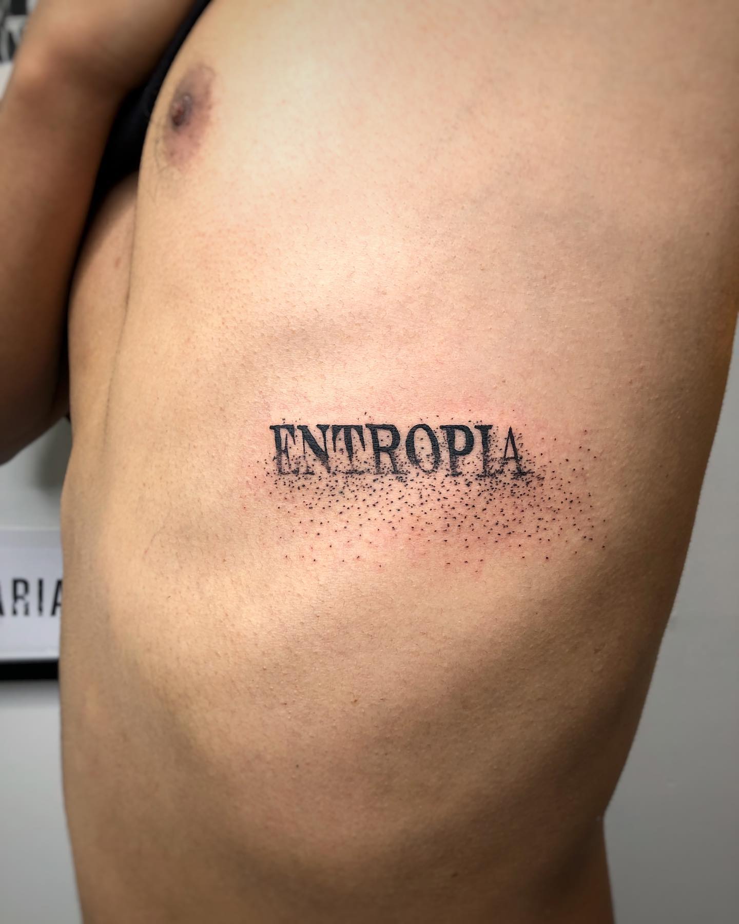 Entropía Tatuaje de una sola palabra