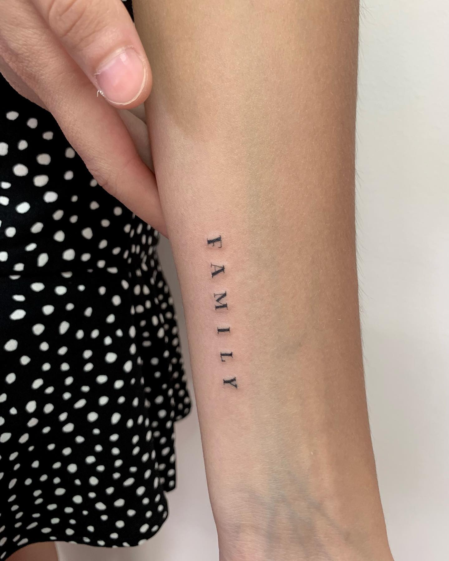 Familia Tatuaje de una sola palabra
