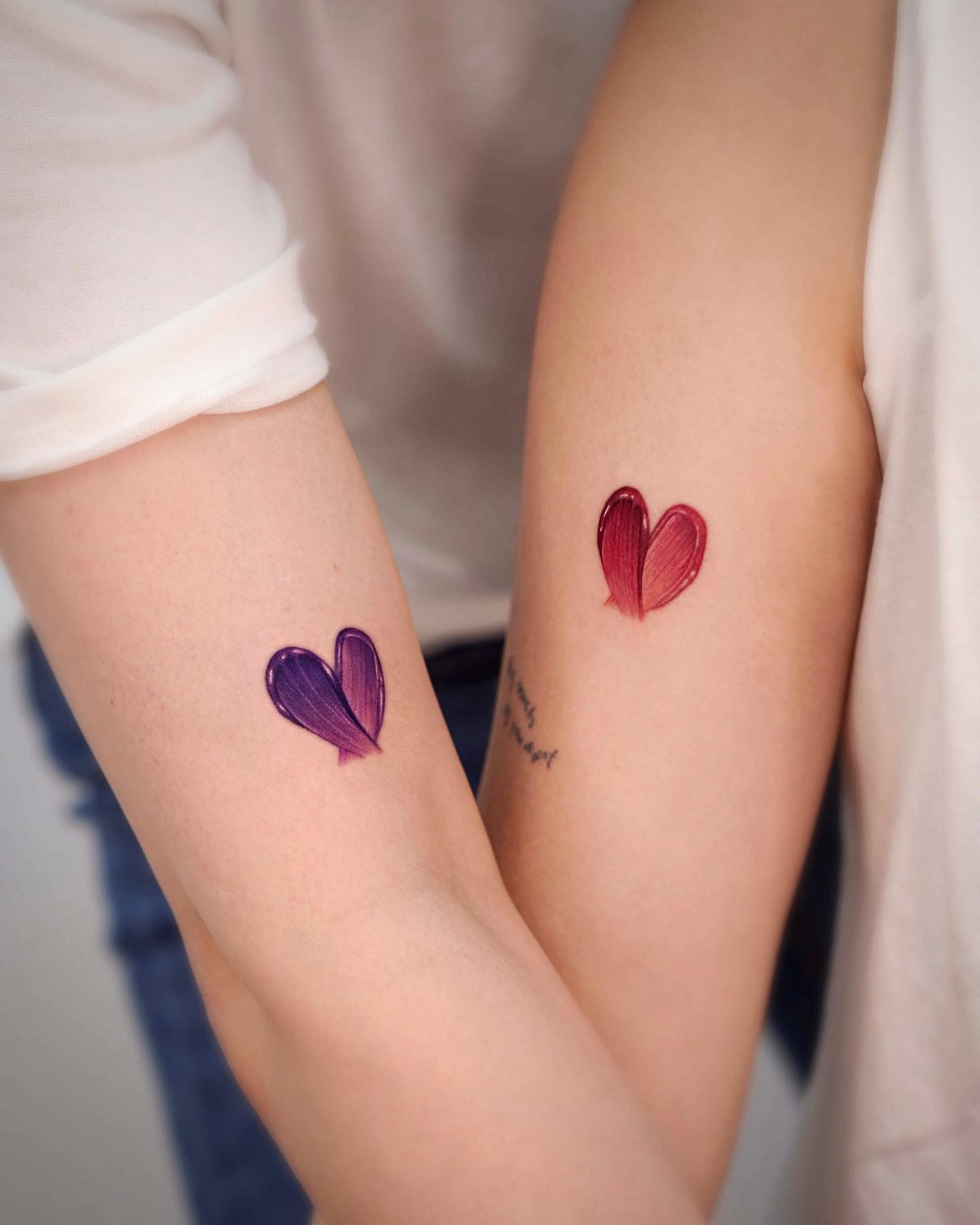 Tatuaje lindo de corazón madre e hija.